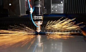 Industrial Laser cutting processing manufacture technology of flat sheet metal steel material with sparks